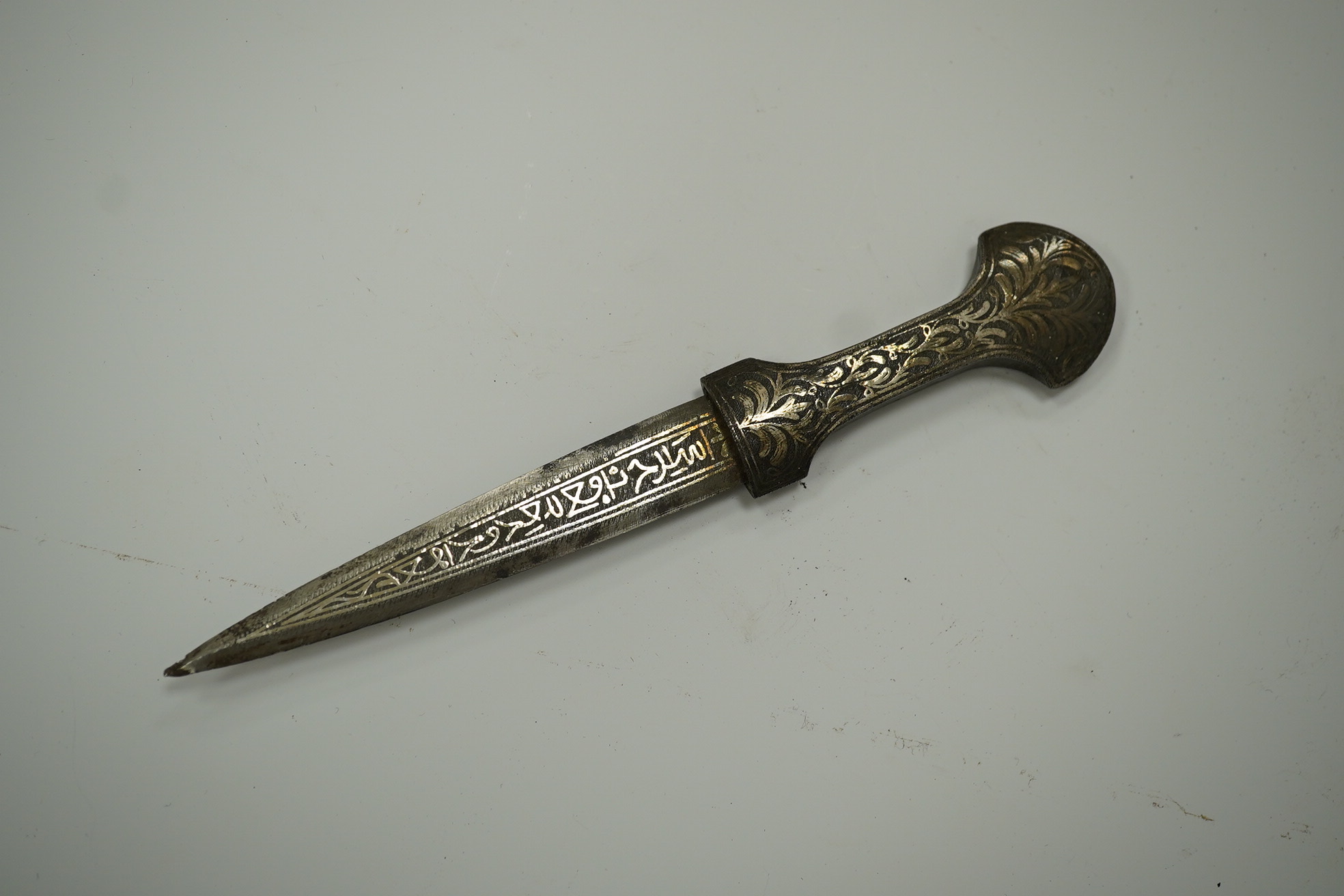 An Ottoman silver damascened dagger c.1900 in matching sheath, blade 9.7cm. Condition - fair